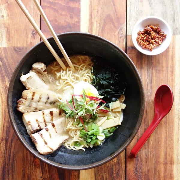 Kameya Ramen & Sushi's ramen bowl with grilled chicken, egg, seaweed, and bamboo shoots.
